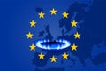 Deficit and gas crisis in Europe. Flag of the European Union with a geographic map and a burning gas stove. Copy space