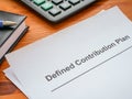 Defined contribution plan papers and a calculator. Royalty Free Stock Photo