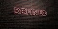 DEFINED -Realistic Neon Sign on Brick Wall background - 3D rendered royalty free stock image