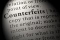 Definition of counterfeits Royalty Free Stock Photo