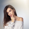 The definition of simplistic beauty. Studio shot of a beautiful young woman posing against a gray background.