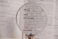 The definition of the word Bibliography in a dictionary, under magnifying glass, translator and language concept