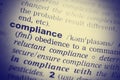 Definition of the word Compliance. Toned image Royalty Free Stock Photo