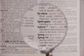 The definition of the word Lycra in a dictionary, under magnifying glass, translator and language concept Royalty Free Stock Photo