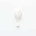 Deflated balloon on the white background Royalty Free Stock Photo