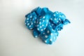 Deflated blue pastel with white dots rubber air balloon
