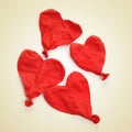 Deflated heart-shaped balloons, with a retro effect