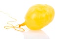 Deflated yellow balloon at a rope Royalty Free Stock Photo