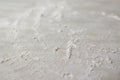 Defocus abstract background. Sprinkled wheat flour circle, round spot on white background. Top view on blackboard