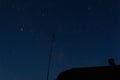 Defocus beautiful night sky. House, roof, chimney and antenna. S Royalty Free Stock Photo