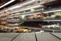 Defocus and blur image of terrace wood and Supermarket