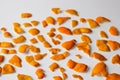 Defocus Christmas background. modern trendy peels of orange and tangerine on a white background. Many small pieces of Royalty Free Stock Photo