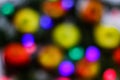 Defocus Christmas colorful New Year's Bokeh neon lights. Abstract Blurred photo background with blinking lights from Royalty Free Stock Photo