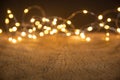 Defocus christmas lights on wooden background. selective focus on wood planks Royalty Free Stock Photo
