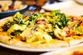 Defocus close up Caesar pizza with chicken and iceberg salad on restaurant, cafe, pizza time. Appetizer italian dish