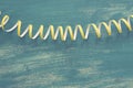 Defocus is a detailed image of colorful streamers serpentine on a wooden blue vintage background.