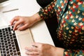 Defocus female hand typing laptop. Unrecognizable elegant woman working on computer at office. Start or finish of a work Royalty Free Stock Photo