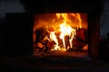 Defocus fire flame background. Firewood burning in old stove or oven. Dark and black. Orange flame. Heat energy. Open