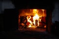 Defocus fire flame background. Firewood burning in old stove or oven. Dark and black. Orange flame. Heat energy. Open