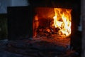 Defocus fire flame background. Firewood burning in old stove or oven. Dark and black. Orange flame. Heat energy. Open