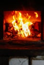 Defocus fire flame background. Firewood burning in old stove or oven. Dark and black. Orange flame. Heat energy. Open