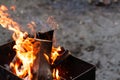 Defocus fire flame firewood fireplace wood. Bright flames burning wood on black background. Camp fire in the night. Cold Royalty Free Stock Photo