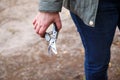 Defocus gardening scissors. Female hand holding gardening scissors. Gardener with pruning shears in hand. Nature blur