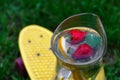 Defocus glass jug of lemonade with strawberry, slice lemon and leaves of mint on yellow penny board, skateboard. Blurred Royalty Free Stock Photo