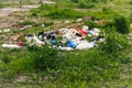 Defocus huge landfill of garbage. Concept of ecology. Large garbage pile on nature green grass background, global