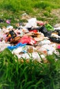 Defocus huge landfill of garbage. Concept of ecology. Large garbage pile on nature green grass background, global