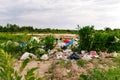 Defocus huge landfill of garbage. Concept of ecology. Large garbage pile on nature green grass background, global