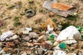 Defocus huge ruins, wreck in Ukraine, war. House after russian attack. Large garbage pile on nature green grass