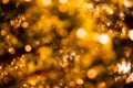 Defocus lights with bokeh shining brightly golden background, blur, soft focus. Autumn and honey gold theme.