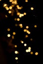 Defocus lights, garlands on the Christmas tree. Lights on a black background Royalty Free Stock Photo