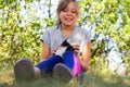 Defocus little expression girl playing and caress cat, black and white small kitten. Nature blurred green summer Royalty Free Stock Photo