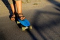 Defocus little urban boy standing on a blue penny skateboard. Young kid in the park. City style. Urban kids. Trendy Royalty Free Stock Photo