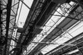 Defocus and low angle interior view of the ceiling with steel structure and skylight of industrial building or factory. Royalty Free Stock Photo