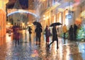 Defocus people silhouette walking wint black umbrellas under rain on evening stree  Christmas decoration and  blurred light in Tal Royalty Free Stock Photo