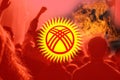 Defocus protest in Kyrgyzstan. Conflict war between Kyrgyzstan and Tajikistan over border. Conflict. Country flag. Fire