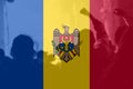 Defocus protest in Moldova. Moldova flag painted on many people hands background. Strength, Power, Protest concept