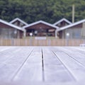 Defocus Rustic landscape wooden houses hill forest sky. Royalty Free Stock Photo