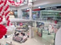 Defocus scene inside a modern shopping mall. Blurred background of commercial center indoors view Royalty Free Stock Photo