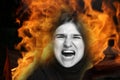 Defocus screaming, hate, rage. Crying emotional angry woman screaming on flame background. Emotional, young face Royalty Free Stock Photo