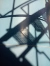 defocus staircase shadow on metal wall of storage tank in industrial building Royalty Free Stock Photo