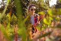 Defocus teen or preteen girl walking on nature background. Little kid girl looking and search pampas grass. Blurred reed Royalty Free Stock Photo