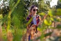 Defocus teen or preteen girl walking on nature background. Little kid girl looking and search pampas grass. Blurred reed Royalty Free Stock Photo