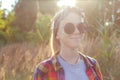 Defocus teen or preteen girl walking on nature background. Little kid girl holding bunch of pampas grass. Green meadow Royalty Free Stock Photo