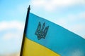 Defocus Ukraine flag. Closeup trident. National symbol fluttering in blue sky. Support and help Ukraine, Independence