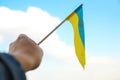 Defocus Ukraine flag. Large national symbol fluttering in blue sky. Support and help Ukraine, Independence Constitution