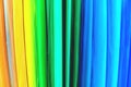 Defocused abstract background, colored stripes, vibrant rainbow colors. Materials for creativity. Colored paper.